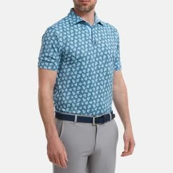 FootJoy Shadow Palm Print Pique Golf Polo Shirt 9 FootJoy Shadow Palm Print Pique Golf Polo Shirt -Putter Sales FootJoy SS22 Shadow Palm Print Pique Golf Polo Shirt Ink Dusk Blue 88375 model 1