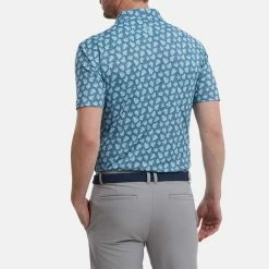 FootJoy Shadow Palm Print Pique Golf Polo Shirt 11 FootJoy Shadow Palm Print Pique Golf Polo Shirt -Putter Sales FootJoy SS22 Shadow Palm Print Pique Golf Polo Shirt Ink Dusk Blue 88375 model 3